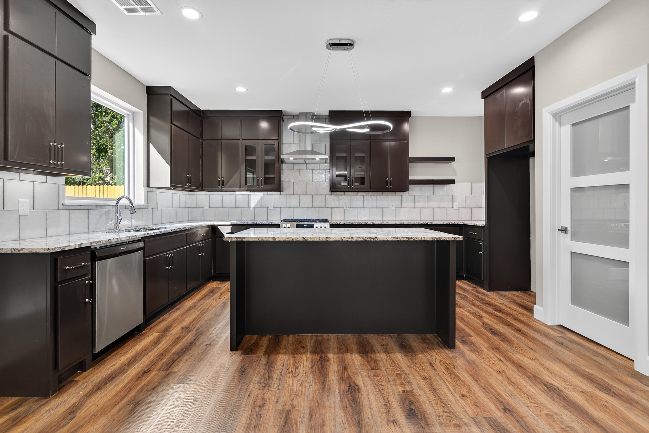 Modern kitchen with dark cabinetry